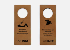 Stained wood hotel door hanger