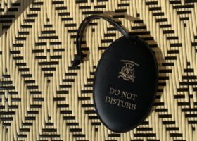 Leather oval hotel room signs