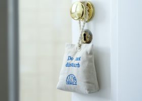 Embroidered do not disturb sign in linen