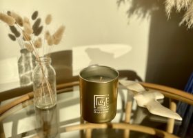 Scented candle in gold metal glass
